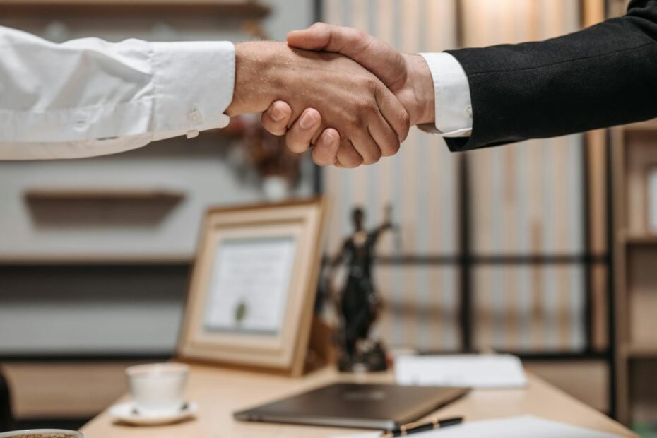 close up photo of people shaking hands